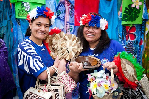 Malia Sio and Falemauga Tutu with a colourful selection of Pacific crafts 