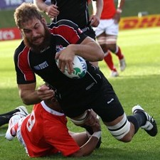 Second row Jebb Sinclair dives over for Canada's first try against Tonga