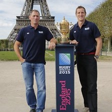 Olivier Magne and Will Greenwood with the Webb Ellis Cup in front of the Eiffel Tower.