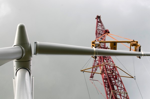 Turbine blade being assembled to first Wind Turbine at Te Uku