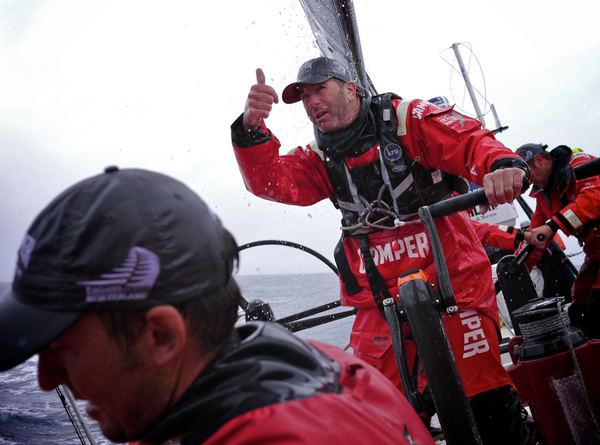 Rob Salthouse gives the thumbs up to CAMPER's bowman during a sail change.