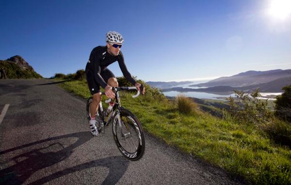 Hayden Roulston trains on part of the route Le Race will take on Saturday, the Summit Road, high above Lyttelton Harbour 