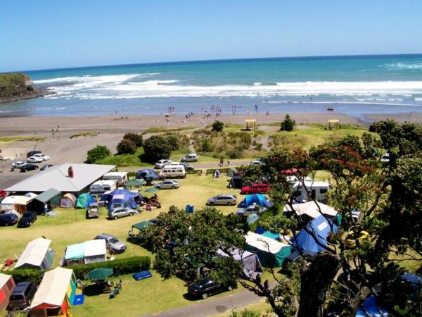 Holiday park leasehold interest (business) for sale NZ unique beachfront location in sheltered sandy bay