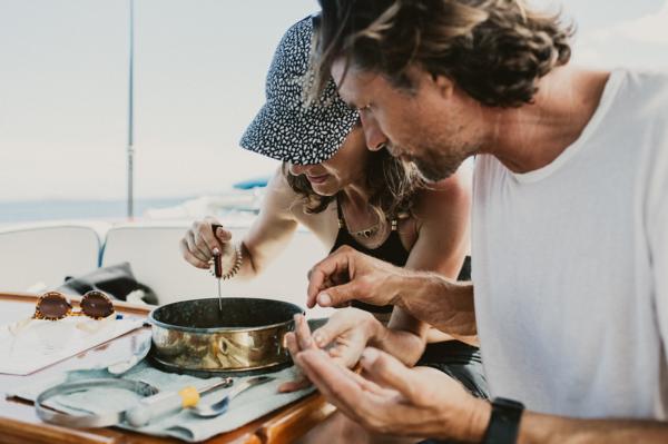 Kiwi actor Martin Henderson looks at plastic gathered from a trawl