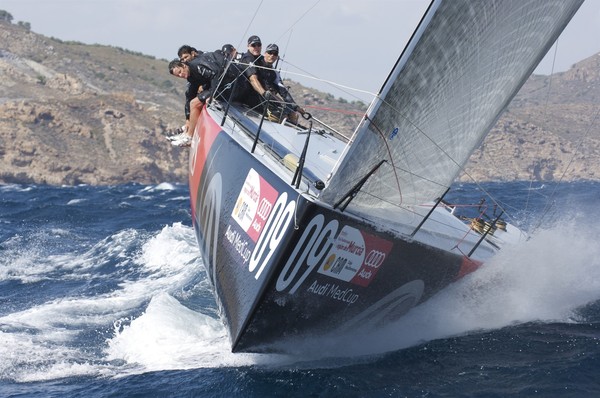 Emirates Team New Zealand powered away in heavy conditions to win two out of two on the first day of racing in the Audi MedCup regatta in Cartagena.