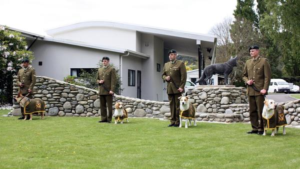Defence Force dog handlers with their dogs, graduate from NZ Defence Force's first explosive detection dog course.