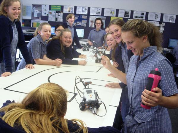 A Year 10 Class Watches A Robot They Have Programmed