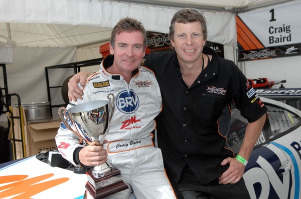 Craig Baird, awarded the Jim Clark Trophy, and a special citation at the Motorsport New Zealand awards evening, celebrates with Triple X Motorsport car engineer Tim Lloyd the 2008/2009 Porsche GT3 Cup Champion trophy season title 