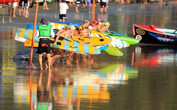 An under-16 board race heat gets underway at Ohope Beach.