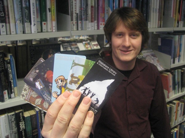 Daniel Mayo-Turner shows off some of the new library cards on offer
