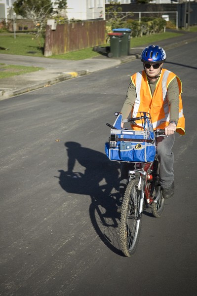  Canterbury University PhD student, Woody Pattinson, on his quarter century old bike with a basket on the front containing air quality measuring equipment
