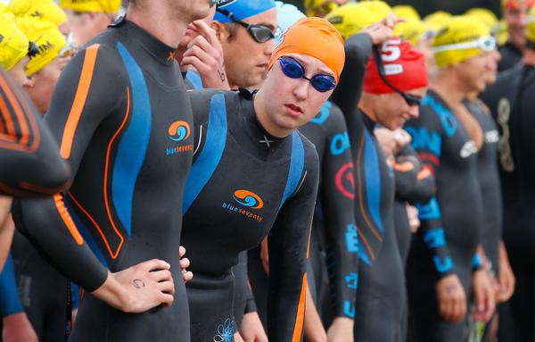 Emma Robinson (orange cap) looking out of the line before the start of the Harbour Crossing in 2013. 