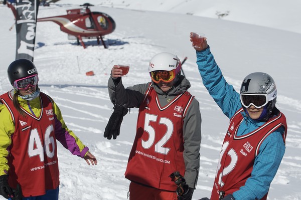 Ingrid Backstrom, Jackie Passo and Maria Kuzma enjoying celebrating at the VnC Cocktail Downhill on the final day of competition at the World Heli Challenge