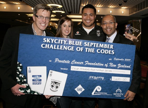 Geoff Burton from MWC Media, Nikki Burgess from Vodafone, Joe Vagana and Ejaaz Dean Executive Manager of Table Games for SKYCITY Auckland with the cheque and trophy from the event.