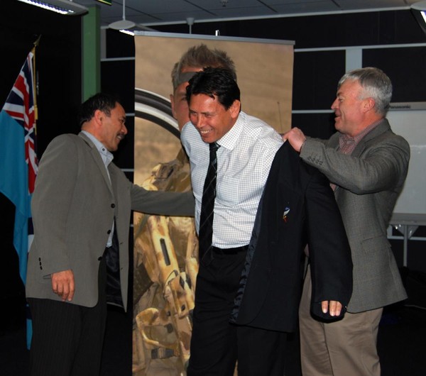 Former All Black and ex Navy Buck Shelford tries on his new Defence Force jacket with Chief of Defence Force LTGEN Jerry Mateparae and Chief of Navy R ADM Tony Parr