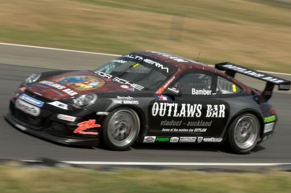 Earl Bamber secured his first podium finish in a saloon car race today by finishing third driving the Outlaws Bar Porsche 997 for the Triple X Motorsport team at Ruapuna near Christchurch today