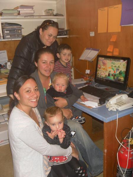 Queenstown Playcentre staff mums with their children beside the SKYCITY Queenstown Casino Community Trust funded computer