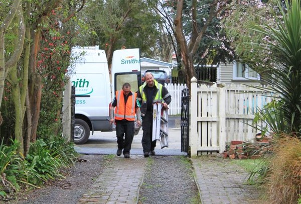 Smith and Smith is working from dawn to dusk in a bid to help restore earthquake victims' glass-shattered Christchurch homes.