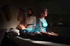 Dr Natasha Tassell, standing at the bedside, and Dr Mary Murray are midway through their study of near-death experiences, which many respondents say include sensations of leaving the body.