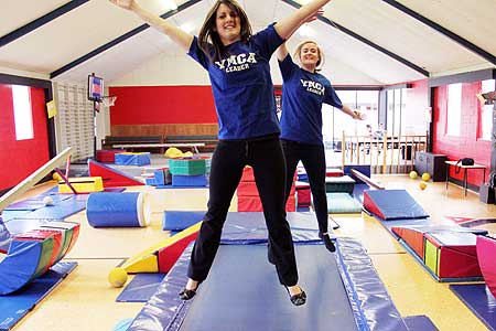 Kelly Weaver and Kelsy Lochead celebrate in the YMCA's recreation area.