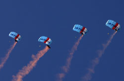 The RNZAF Kiwi Blue parachute display team in action