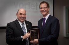 Simon Dallow accepts a Variety International Presidential Citation from Variety International President Peter Drummond