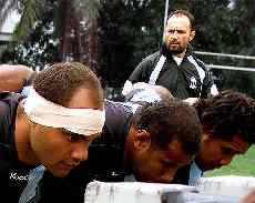 Top, Deacon Manu prepares with his Fiji team  mates under the eye of scrum coach Michael  Foley for the Rugby World Cup.