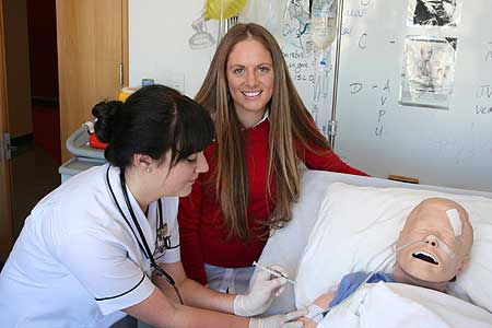 Bachelor of Nursing second year student Samantha Dennis, at left, with Jessica McIvor who has devised a manual to ease the anxiety of getting a jab for needle phobic people.