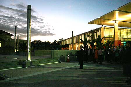 Staff, students and supporters gather at dawn to bless the pou and Student Central building.