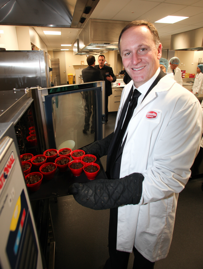 Prime Minister John Key gets to grips with Hansells Food Group products in the organisation's new innovation centre.