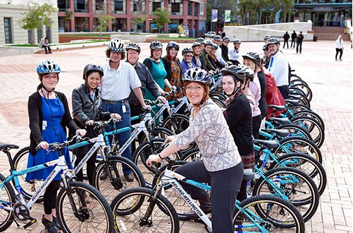 Mayor Celia Wade-Brown (right front) with some of the 99 gifted bicycles