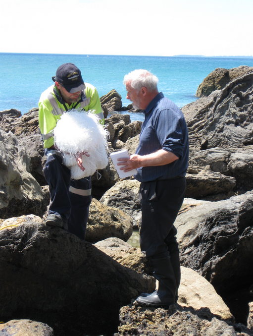 Peter Braddock, an Australian marine pollution officer who joined the Maritime New Zealand team speaks to a reporter about the use of oil absorbing polypropylene in filtering oil from water.