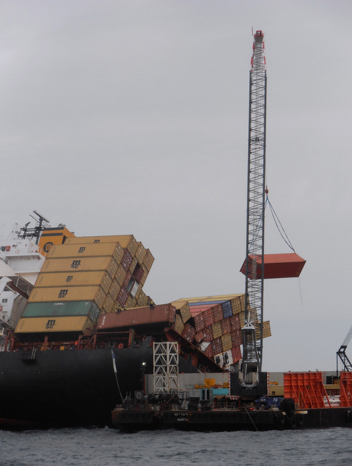 Container removal continues with the Sea Tow 60 astern of Rena