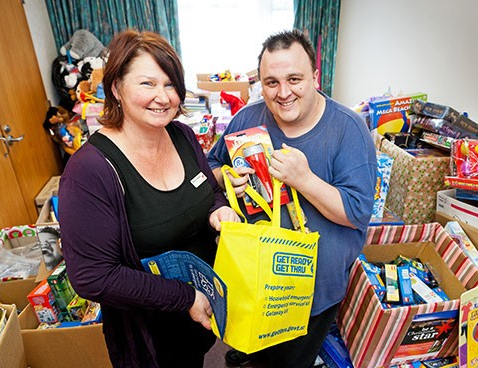 This year's Christmas food parcels include emergency preparedness items. 