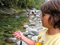 Niki Elliot looking at the water flow, water clarity and temperature.