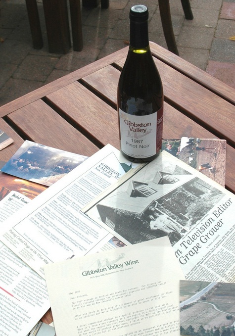 A bottle of Gibbston Valley Winery's first commercially produced Pinot Noir with promotional material from the time.