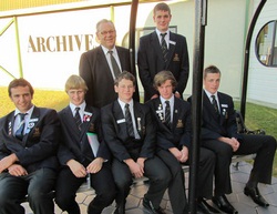 The boys, with their rowing coach Bill Campbell.