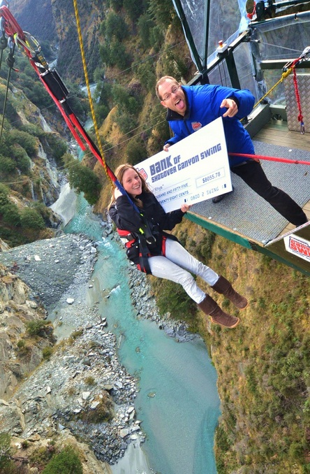 Susie Swaffield receives a cheque from Shotover Canyon Swing on behalf of the Help Heal Rhys Foundation.