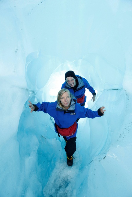 Ashley Loewen and Matthew Black up close and personal to the ice on their Franz Josef Glacier Guides Ice Explorer trip.