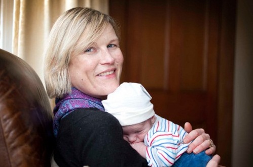 Jill Shaw with baby Rory - their home is now warmer and drier