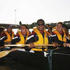 USA players in Maori canoes on the Whanganui River on Sunday