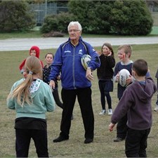 Robert Antonin enjoys a game with school children in Queenstown