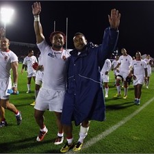 Taniela Moa leads the celebrations after Tonga beat Japan
