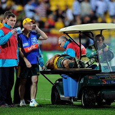 Anthony Faingaa is taken off after being knocked out late on against USA