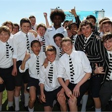 Wallaby Radike Samo with students during a visit to Christchurch