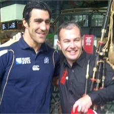 Kelly Brown with Red Hot Chilli Piper Kevin Macdonald. (Photo: Scottish Rugby)