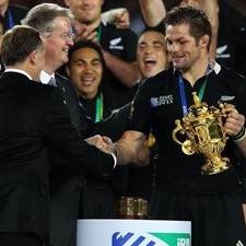 Bernard Lapasset hands Richie McCaw the Webb Ellis Cup 