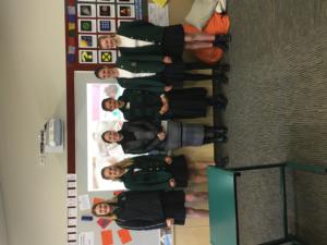 St Margaret's College students presenting the cheque to Lydia Hemingway from the Child Cancer Foundation