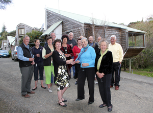  Sue Hodge, left, hands keys to the council's Russell pensioner units to Lorraine Young.  