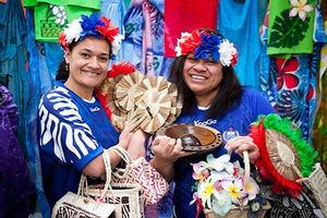 Malia Sio and Falemauga Tutu with a colourful selection of Pacific crafts 